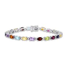 Bask in a kaleidoscope of color! With a vibrant twist on the classic tennis bracelet, you'll fall in love with a winning combination of multiple oval-cut gemstones. The array stars aquamarine, amethyst, citrine, garnet, iolite, and peridot. Fashioned in stylish sterling silver, the 7-inch bracelet secures with a box clasp. Fine Jewelry Multicolor Gemstone Diamond Bracelet, Multicolor Gemstone Diamond Bracelet, Oval Multi-stone Tennis Bracelet In Fine Jewelry Style, Multi Gemstone Bracelet, Box Clasp, Citrine Stone, Garnet Stone, Jewelry Repair, Bracelet Clasps