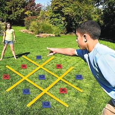 two children playing with an interactive game in the grass