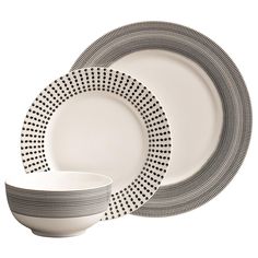 a white and black dinner set with two plates, one bowl and the other plate