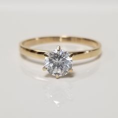 "Thanks for shopping our vintage estate store. We tend to sell well below wholesale and truly hope you enjoy all of our items. Many of the items are one of a kind, so please enjoy scrolling through the pictures and hopefully something will catch your eye. Black spots are from camera or reflections. Estate 14k yellow gold CZ 1.25ct diamond engagement ring. Ring size: 10 Setting: 7.5mm 1/4\" Band width: 2mm Weight: 2.13 grams Marked 14k and stunning engagement ring. Great to wear out when you do n Classic 14k Gold Heart Cut Jewelry, Classic 14k Gold Heart Cut Wedding Ring, Classic Solitaire Heart Cut Jewelry, Classic 14k Gold Heart Cut Diamond Ring, Classic Round Cut Diamond Ring Stamped 14k, Classic Heart Cut Diamond Ring Gift, Classic Heart Cut Wedding Ring With Vvs Clarity, 14k Gold Classic Cut Wedding Rings For Anniversary, Classic Solitaire Diamond Ring With Heart Cut