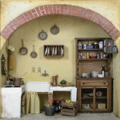 an old fashioned kitchen with pots and pans on the wall