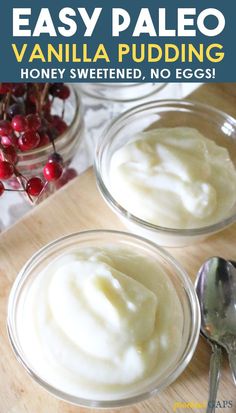 two bowls filled with yogurt sitting on top of a wooden cutting board next to cherries