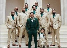 a group of men in suits posing for a photo