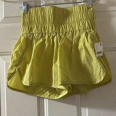 Fp Movement By Free People The Way Home Shorts Khaki/Yellow New With Tags Size S Stock: Ltpink18888 Features Brief Liner Spring Workout Shorts With Pockets, Spring Shorts With Pockets For Warm Weather, Yellow Stretch Shorts For Beach, Yellow Stretch Shorts For Vacation, High Waist Yellow Shorts For Beach, Yellow Cotton Shorts With Pockets, Trendy Yellow Shorts With Pockets, Yellow Stretch Cotton Bottoms, Stretch Yellow Cotton Bottoms