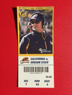 a ticket for the california state football team is displayed on a red surface in front of a red background