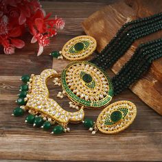 This is a stunning handmade necklace perfect for high end Jewelry Collector, a keeper in Traditional Vintage Indian/Pakistani Bridal jewelry and a Luxury Gift for your Daughter, Sister or Wife on Wedding or Anniversary. Perfect for any type of occasions, weddings And celebrations and a beautiful & memorable gift for weddings and special occasions. -Item Code:- L624 -Bottle Green Gemstone Beaded Necklace Set with Earrings. -Designer multi layered faceted Bottle Green Gemstone beaded necklace. -Gold Plated Set with Kundan Stones which shine like Polki Diamonds. -Metal: Gold plated brass -Earrings are 55mm long & 28mm wide approx -Push Back Earrings -Necklace length with pendant 12" approx excluding adjustable dori/cord -Quantity:- One Necklace Set Please see more different designs here:- htt Luxury Meenakari Pearl Necklace For Celebration, Luxury Meenakari Gold Plated Necklaces, Luxury Bridal Meenakari Pendant Necklace, Luxury Brass Jewelry With Meenakari, Luxury Meenakari Necklaces For Gift, Pakistani Bridal Jewelry, Necklace Set With Earrings, High End Jewelry, Gemstone Beaded Necklace