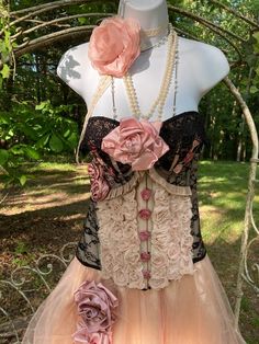 Gorgeous handmade bustier corset rows of pink shabby roses adorn center black lace back and cups  venetian lace at top of cups small satin roses cover center closure dusty colored handmade flowers at right cup  pale satin ruffles under bust large handmade pink rose in center of bust Large/XL: C or D bust 30.5 " flat across waist, meant to be cinched 15 " long from bust to bottom adjustable corset tie back hook and stud closure front Corset Tie Back, Venetian Lace, Tie Back Hooks, Vampire Aesthetic, Satin Roses, Corset Lingerie, Lace Back, Corsets, Corset Top