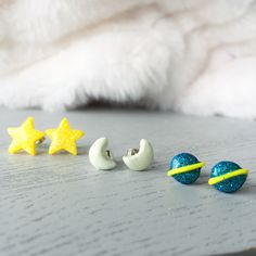 Buy 3 items or more can get 20% OFF!! These cutie stud earrings set are hand sculpted from polymer clay and glitter, set onto surgical steel posts and backings. All are 100% handmade with different theme and styles. It may be your perfect choice for a gift to your loved one. Star size 14mm; Moon size 6mm x 10mm; Planet size 8mm x 11mm. It also can be made with adjustable ear clip, just let me know if you like to change it. Only AUD$10 extra charge if you would like a set with a Gift Box, and wil Handmade Space-themed Earrings For Gift, Handmade Space-themed Earrings As Gift, Surgical Steel Earrings, Moon Studs, Studs Earrings, Triangle Earrings, Star Studs, Stud Earrings Set, Gorgeous Earrings