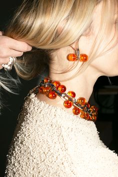 A chunky, linked statement necklace punctuated with amber colored beads. About 19" long including the clasps. Sphere Earrings, Saturn Necklace, Jewelry Photography Styling, Jewelry Editorial, Chunky Bead Necklaces, Big Balls, Ball Necklace, Messaging App, Diy Necklace