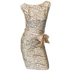 Absolutely beautiful vintage late 1950s EDWARD ABBOTT champagne beige silk brocade beaded demi couture wiggle dress! Stunning silhouette that really flatters the body. Luxurious silk brocade in a lovely beige champagne color, with thousands of hand-sewn sequins, rhinestones, crystals and beads throughout. Attached silk belt features a bow on the left side waist. Insanely good construction with heavy attention to even the smallest of details. Full metal zipper up the back with hook-and-eye closur Champagne Gown, Drape Gowns, Beige Silk, Vintage Dresses 50s, Satin Cocktail Dress, Cocktail Dress Vintage, Silk Chiffon Dress, Boy London, Full Dress