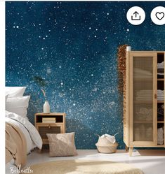 an image of a bedroom with stars in the sky on the wall and bedding