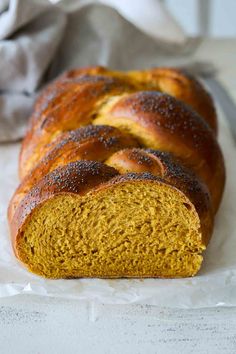 a loaf of bread sitting on top of a piece of wax paper