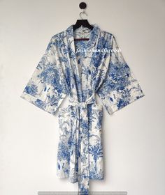 ITEM DESCRIPTION: These Cotton Floral Print Robes are luxurious and sweet, and will make you and your bridesmaids feel like you're blossoming flowers ! These robes are perfect for bridesmaids gifts, birthday gifts, and perfect gifts for girls who are in college. A beautiful lightweight cotton kimono-style hand-printed dressing gown. The gown is 100 cms length and 120 cms wide / bust approx. Features two front pockets, belt and loops. This soft cotton fabric is from India. Fabric has soft touch. Kimono Beach Cover Up, Gown Bridesmaid, Kimono Dressing Gown, Bath Robes For Women, Bohemian Kimono, Bridesmaid Gowns, Kimono Design, Printed Robe, Cotton Kimono