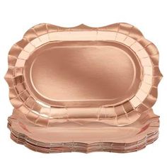 a rose gold foiled paper plate with scalloped edges on a white background