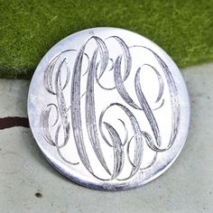 Vintage sterling silver handmade brooch, round tag with name monogram "GCCV" engraved, silver tested Elegant Personalized Silver Brooches, Silver Engraved Brooch For Anniversary, Round Engraved Brooches As Gifts, Sterling Silver Round Brooches For Anniversary, Round Engraved Brooches For Gifts, Silver Medallion Brooches As A Gift, Personalized Silver Brooches For Anniversary, Silver Round Brooches For Anniversary, Classic Engraved Silver Brooches