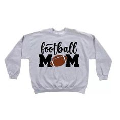 Be the loudest and proudest mom in the stands with this FOOTBALL MOM graphic  sweatshirt!  12x12 across front of sweatshirt Fall Sports Team Sweatshirt, Fall Team Name Sweatshirt Fan Apparel, Fall Fan Apparel Sweatshirt With Team Name, Relaxed Fit Sweatshirt For Sports Events In Fall, Baseball Season Sweatshirt With Graphic Print For Fans, Casual Sweatshirt With Text Print For Fans, Fan Merchandise Lettering Tops For Fall, Game Day Fan Apparel Sweatshirt In Athletic Heather, Team-colored Graphic Print Sweatshirt For Football Season