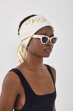 Look no further for the ultimate summer accessory that will have you feeling like you're in the Italian Rivera. Silky smooth feel scarf. Screen printed design. Invisible finish. Featuring golden yellow framing finish with a gorgeous print in the center. Compliments and elevates any summer outfit. Style it with your favorite swim and resort pieces to perfect the Italian summer look. Color: Golden Yellow Monogram Fabric composition: 100% Polyester Scarf size: 80 cm X 80 cm Care: Hand wash only in Chic Summer Beach Headscarf, White Summer Scarf Bandana, Summer Cotton Headscarf For Beach, Trendy Summer Cotton Scarves, Cotton Headscarf For Summer Beach, Trendy Cotton Summer Scarves, Trendy Cotton Scarf For Summer, Trendy Cotton Scarves For Summer, Elegant Yellow Summer Scarf