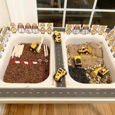 two trays filled with dirt and construction vehicles