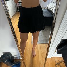 Never Worn Black Skirt! Size Medium Black Lined Tiered Skirt, Casual Black Ruffled Skirt, Black Skort For Beach, Short Black Beach Skirt, Black Relaxed Fit Tiered Skort, Black Tiered Skort, Black Flowy Bottoms For Day Out, Black Ruffled Skirt Skort For Day Out, Casual Ruffled Skirt For Night Out