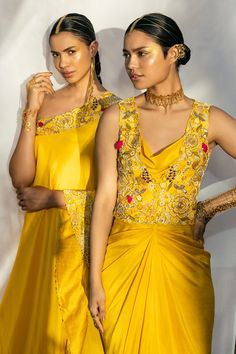 Yellow kaftan-style kurta highlighted with zardozi-resham embroidery, one-shoulder neckline and asymmetric hem. Comes with dupion silk pant.
Components:2
Pattern:Embroidered
Type of Work:Floral
Neckline:One-Shoulder
Sleeve Length:Asymmetric
Fabric:Dupion Silk
Color:Yellow
Other Details:
Zardozi, resham, nakshi and dabka embroidery
Farshi pant
Note: The gown worn by the model is not for sale
Occasion:Mehendi and Haldi, Sangeet - Aza Fashions One Shoulder Kurta, Yellow Kaftan, Dabka Embroidery, Resham Embroidery, Silk Pant, Kaftan Style, Dupion Silk, Kurta With Pants, Silk Pants