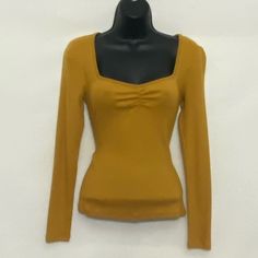 Ambiance Nwt, Mustard Yellow, V-Neck, Long Sleeve, Pullover Blouse. Business Casual. Thin & Lightweight. Soft. Stretchy. Cotton & Spandex Blend Material. New With Tags. Never Worn. Size S Bust 14” Length 22” Sleeve Length 23 1/2” Measurements Are Approximate & Made With Blouse Lying Flat. Make An Offer! All Reasonable Offers Considered! For The Best Possible Deal, Bundle With Other Amazing Items From This Closet. Shop With Confidence Posh Ambassador Ii Top Rated Seller Fast Shipper - Same Or Nex Blouse Business Casual, Mustard Yellow Top, Low Neckline, Yellow Shirts, Yellow Top, Mustard Yellow, Long Sleeve Pullover, Top Rated, Cotton Spandex