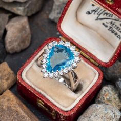 This magnificent ring is centered with a pear mixed cut aquamarine, weighing 3.90 carats, in a multi-prong setting. The center is surrounded by a halo, prong set with nineteen (19) round brilliant cut diamonds. The ring measures 18.3mm at the top, rises 7.5mm above the finger, tapering to 5.4mm wide and 1.4mm thick at the base of the European style shank. This ring is currently a size 4.5. Aquamarine Cocktail Ring, Brand Presentation, Brilliant Diamond, Pear Cut, Round Brilliant Cut Diamond, Cocktail Ring, High Quality Jewelry, Brilliant Cut Diamond, Cocktail Rings