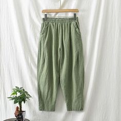 Material: 30%-50% Cotton, 30%-50% Linen Pattern: Solid Color Highlight: Pocket, Elastic Waist, Split Season: Spring, Summer, Autumn Non-stretch Solid Color Casual Harem Pants, Spring Green Baggy Wide Leg Pants, Spring Green Loose Fit Wide Leg Pants, High Waist Relaxed Fit Solid Color Harem Pants, Spring Solid Color Baggy Pants, Spring Baggy Solid Color Pants, Baggy Solid Color Pants For Spring, Green Casual Pants With Elastic Waistband, Casual Green Pants With Elastic Waistband