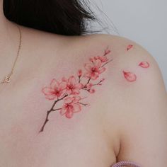 a woman's breast with flowers painted on it