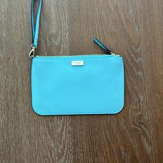 -Lighter Blue In Person, More Like The Photo On Website -Brand New, Never Used Blue Clutch With Zipper Pouch, Blue Designer Clutch With Removable Pouch, Everyday Blue Pouch Wristlet, Blue Travel Wristlet With Removable Pouch, Blue Clutch Wristlet For Travel, Blue Wristlet With Removable Pouch For Travel, Blue Bags With Wrist Strap For Daily Use, Blue Wristlet With Zipper Pouch For Daily Use, Blue Wristlet With Zipper Pouch For Travel