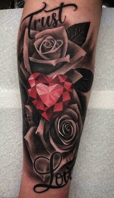 a black and grey rose tattoo with the word trust on it's side, surrounded by hearts