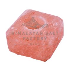 a pink rock with the words himalayan salt factory on it's front and side