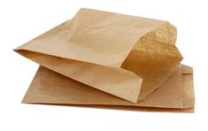 two brown paper bags sitting on top of each other