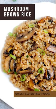 mushroom brown rice on a white plate with green onions