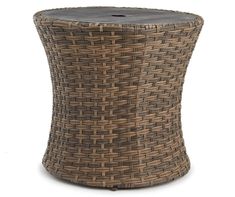 a round wicker table with a wooden top