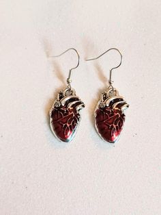 Anatomical heart dangling earrings with hypoallergenic and nickel free backs of your choice Hypoallergenic Drop Earrings For Valentine's Day, Gift Dangle Earrings, Silver Surgical Steel Heart Jewelry, Red Hypoallergenic Metal Jewelry, Hypoallergenic Red Metal Jewelry, Silver Heart-shaped Surgical Steel Jewelry, Surgical Steel Drop Earrings As Gift, Surgical Steel Drop Earrings For Gift, Heart-shaped Surgical Steel Jewelry For Gifts