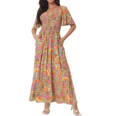 A floral maxi dress featuring a round neckline, short sleeves, and a shirred waist with a flowy silhouette. The semi-loose cut of this dress paired will quickly make this dress a favorite! This color is 100% Rayon, for a better dress experience, suggest ironing it low before wearing it! Enjoy all of the compliments in this bohemian maxi dress! Great for casual, work, beach, date, party, honeymoon, holiday, family gatherings and photoshoots, etc. Flowy Flutter Sleeve Maxi Dress For Vacation, Casual Smocked Flowy Dress With Elastic Waistband, Casual Flowy Smocked Dress With Elastic Waistband, Casual Spring Maxi Dress With Elastic Waistband, Summer Maxi Length Smocked Dress With Elastic Waistband, Casual Smocked Maxi Dress With Elastic Waistband, Billowy Maxi Dress With Smocked Back, Bohemian Smocked Short Sleeve Dress With Floral Print, Summer Beach Maxi Dress With Gathered Waist