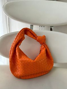 GIFT WRAPPING AVAILABLE: simply mark your order as a "gift" Introducing our stylish dumpling bag with woven knot detail, perfect for the modern woman on-the-go! This hobo shoulder braid bag in trendy orange color is not only a fashion statement but also a functional accessory. With its unique design and high-quality craftsmanship, this best seller is sure to impress. Treat yourself or surprise your girlfriend with this must-have gift that will elevate any outfit effortlessly. Order yours today a Trendy Tote Baguette Bag As Gift, Trendy Handheld Baguette Bag Gift, Trendy Satchel Baguette Bag As Gift, Baguette Bag With Removable Pouch As Gift, Trendy Baguette Bag For Gift, Trendy Baguette Bag As Gift, Trendy Baguette Shoulder Bag For Gift, Trendy Baguette Shoulder Bag As A Gift, Trendy Single Handle Shoulder Bag As Gift