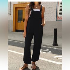 Casual Jumpsuit, Black With Adjustable Straps Black Sleeveless Overalls For Work, Sleeveless Black Overalls For Workwear, Black Sleeveless Workwear Overalls, Casual Black Jumpsuits And Rompers With Pockets, Chic Black Overalls For Spring, Sleeveless Black Overalls For Spring, Black Overall Jumpsuits And Rompers With Pockets, Black Overalls And Rompers, Black Solid Color Jumpsuits And Rompers