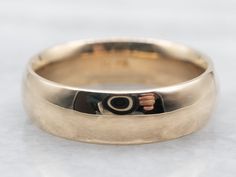 "This simple wedding band is made special due to the quality of the metal! Crafted of yellow gold, this ring has a rich hue and fantastic polish that feels luxurious. The generous width and subtle dome make this band perfect for larger hands. Metal: 14K Yellow Gold Width of Band: 6.0 mm Height off Finger: 2.2 mm Ring Size: 8.50 Marks: \"BZ 14K\" Stamped on the inside band To view a video of this piece check out the link below: https://vimeo.com/832683152 SKU #: A24874 Each piece has been identified and graded by a Graduate Gemologist who has been certified by the Gemological Institute of America (GIA). We have six brick-and-mortar storefronts in Maine, Massachusetts, and New Hampshire and have been in business for over 25 years! Please visit our Shop's About Page or our website for more in Plain Wedding Ring, Simple Wedding Band, Jewelry Stacking, Wide Wedding Bands, Simple Wedding Bands, Stacking Bands, Yellow Gold Jewelry, Watch Chain, Simple Wedding