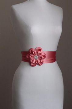 "An accessory to complement your beautiful wedding dress Made of satin fabric with flowers and belt made of silk satin. In the middle of the flower button is used the crystal. Flower size is approximately 5 \"dimensions. The belt length is approximately 80\"dimensions Flower fitted with lapel pins. Then, a flower can be used as a separate lapel pin. Please feel free to contact for questions and requests. PACKAGE ARE SENT BY FAST SHIPPING COMPANY WITHIN 3 TO 4 BUSINESS DAYS, TO UNITED STATES, TO Elegant Fitted Pink Sashes, Pink Elegant Sash For Formal Occasions, Wedding Sashes With Satin Finish, Wedding Bridal Belt With Sashes In Satin, Satin Bridal Belt With Ribbon For Wedding, Pink Sashes Bridal Belt For Wedding, Fitted Satin Bridal Belt With Ribbon, Fitted Satin Bridal Belt For Bridesmaid, Elegant Pink Bridal Belt With Sashes