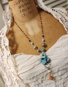 This striking one-of-a-kind silvertone pendant necklace is made of a large slab of turquoise-color, dyed Imperial Jasper,that has been bead-wrapped and accented with both new and vintage beads. The pendant, including the tassel, is 5" long. The beaded strand adjusts from 19 1/4" to 22 1/4"long.   This necklace was so much fun to make! I love it! I think it really makes a statement! Please look at the pictures to see the assortment of wonderful beads! My new vintage jewelry makes a great gift for Mixed Bead Necklace, Imperial Jasper, Art Necklaces, Vintage Beads, Pretty Jewelry, Necklace Unique, Turquoise Color, Pretty Jewellery, Unique Necklaces