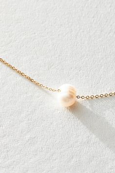 Just as effortless as it is essential, this timeless necklace is featured in a super dainty design with floating freshwater pearl for an added special touch. **Features:** 16" , lobster clasp, note: due to natural variation, each pearl will differ slightly. Keep dry and out of water for best results. Pearls are a soft stone so wear gently. **Why We ❤ It:** Totally timeless in a subtle yet special style, this stunning necklace is the perfect piece to layer up or simply style solo. | Set & Stones Minimalist Pearl Necklace With Cable Chain For Gift, Minimalist Single Strand Akoya Pearl Necklace, Dainty Pearl Necklace With Cable Chain As Gift, Minimalist Akoya Pearl Necklace With Delicate Chain, Minimalist Akoya Pearl Necklace With Pearl Charm, Timeless Necklace, Special Style, Stunning Necklace, Boho Outfits