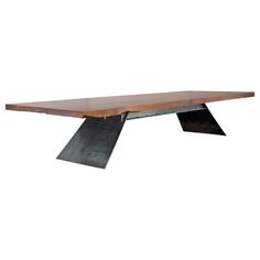 a wooden table with metal legs and a wood slab on the top, against a white background