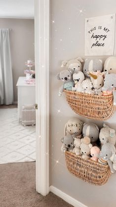 there are many stuffed animals in the basket on the wall next to the door way