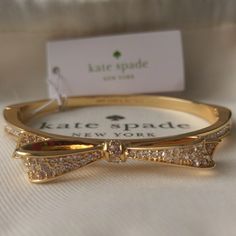 Nwt Kate Spade Love Notes Pave Bow Bracelet Large Hinged Bangle Gold Condition: Brand New With Tag. No Missing Stones. Color: Gold Plates With Crystals Width: 7" Snap-In Closure Msrp: $58.00 Super Cute Kate Spade Bow Bangle Bracelet. Perfect For The Holiday Parties Coming Up. Great Gift Also! Please See All Pictures And Ask All Questions Before Purchasin As All Sales Will Be Final. Thank You. Gold Plates, Bangle Gold, Bow Bracelet, Kate Spade Jewelry, Hinged Bangle, Love Notes, Crystal Bracelet, Gold Bangles, Crystal Bracelets