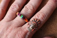 Southwest band ring, sterling silver ring topped with inlay stones, purple (dyed ?) spiny oyster, orange spiny oyster and blue and green stones. The ring is stamped AT sterling. MEASUREMENTS: Size 7 1/2 Width 1/4" at the widest CONDITION:  The ring is in very good vintage condition with light wear and an imperfection in the back of the band, see photos. SEE THE REST OF MY SHOP: www.etsy.com/shop/southwestvintage *International orders are sent USPS First Class mail, tracking is not guaranteed, without insurance. For a shipping upgrade contact me for price quote. Artisan Multicolor Rings With Inlay, Artisan Multicolor Inlay Rings, Southwestern Multicolor Inlay Rings, Southwestern Style Multicolor Inlay Rings, Purple Dye, Hippy Gifts, Green Stones, Spiny Oyster, Multi Stone