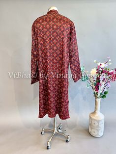 Expertly crafted from high-quality Maroon Gaji Silk, this kurta is a must-have for any fashion-forward individual. The luxurious material offers a comfortable fit while exuding a sense of elegance and sophistication. Perfect for any occasion, this kurta is the epitome of style and versatility. Traditional Unstitched Kurta For Fall, Designer Straight Kurta For Fall, Fitted Kurta For Designer Wear In Fall, Traditional Long Kurta With Printed Motifs, Fitted Long Sleeve Kurta For Fall, Festive Long Sleeve Traditional Wear For Fall, Unstitched Long Sleeve Kurta For Fall, Festive Printed Kurta For Fall, Traditional Long Sleeve Tunic For Diwali