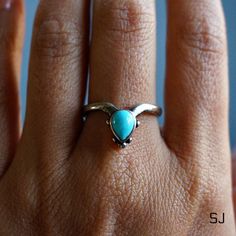 "This fine sterling silver ring features natural turquoise. Adjustable ring band allows you to wear it on any finger or stack with others. 100% Solid 925 sterling silver Authentic turquoise from Arizona, US Handcrafted Size: adjustable band, fits all sizes * By Sowell Jewelry. Stamped with \"925\" and \"SJ\" Official site: www.sowelljewelry.com SUBSTANTIAL PACKAGING: To ensure our packaging is as eco-friendly as possible, we only use recyclable materials such as paper and cardboard." Teardrop Turquoise Sterling Silver Rings, Sterling Silver Teardrop Turquoise Ring For Anniversary, Turquoise Gemstone Stackable Promise Rings, Teardrop Turquoise Ring In Sterling Silver For Anniversary, Turquoise Teardrop Ring In Sterling Silver For Anniversary, Turquoise Stackable Promise Ring, Turquoise Stackable Ring For Promise, Spiritual Sterling Silver Turquoise Promise Ring, Turquoise Stackable Toe Rings