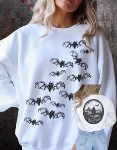 Halloween Sweatshirt, Retro Halloween, Fall Sweatshirt, Trick or Treat, Vintage Halloween Sweatshirt, Spooky Season, Fun Halloween, Bats, Vampires, Plus Sizes, Pumpkin Halloween, Halloween Party Gildan 18000 Sweatshirt - Unisex → 50% Cotton 50% Polyester → Ideal for any situation, a unisex heavy blend crewneck sweatshirt is pure comfort. These garments are made from polyester and cotton. This combination helps designs come out looking fresh and beautiful. The collar is ribbed knit, so it retains its shape even after washing. → There are no itchy side seams on these sweaters.: Medium-heavy fabric (8.0 oz/yd² (271.25 g/mn.: Loose fit\n.: Sewn in label → Runs true to size SIZING → We have size chart on our listing photos PRINT QUALITY → I use only the best DTG printers available to produce th Witch Sweatshirt, Sweatshirt Halloween, Cat Sweatshirt, Halloween Fall, Pumpkin Halloween, Trendy Shirts, Halloween Bats, Retro Halloween, Fall Sweatshirt