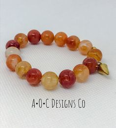 10mm round orange crab fire agate beads Gold plated charm Carnelian Round Beads Bracelet For Gift, Agate Beaded Jewelry With 8mm Beads, Round Agate 8mm Bead Jewelry, Beaded Round Carnelian Bracelet, Beaded Round Carnelian Bracelets, Spiritual Orange Beaded Bracelets As Gift, Orange Gemstone Beads Round Jewelry, Carnelian Natural Stones Beaded Bracelets, Orange Gemstone Round Beads Jewelry